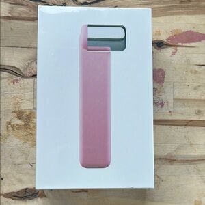 Sleek Pink Facial Skincare Tool with Metallic Accent